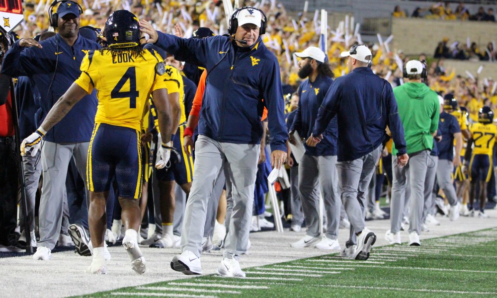 WVU Football HC Rich Rodriguez congratulates Cam Cook