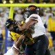 Oklahoma State defender takes down WVU Football QB Michael Hawkins