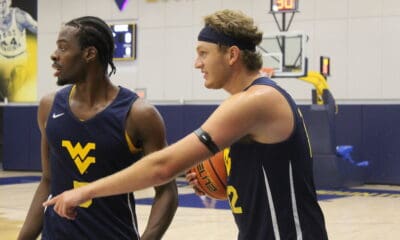 West Virginia basketball players Tucker DeVries and Toby Okani