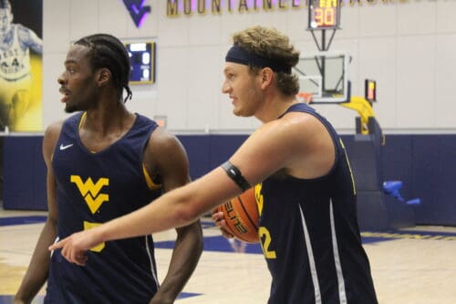 West Virginia basketball players Tucker DeVries and Toby Okani