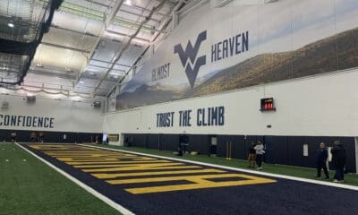 WVU Football indoor facility with Trust The Climb stock