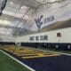 WVU Football indoor facility with Trust The Climb stock