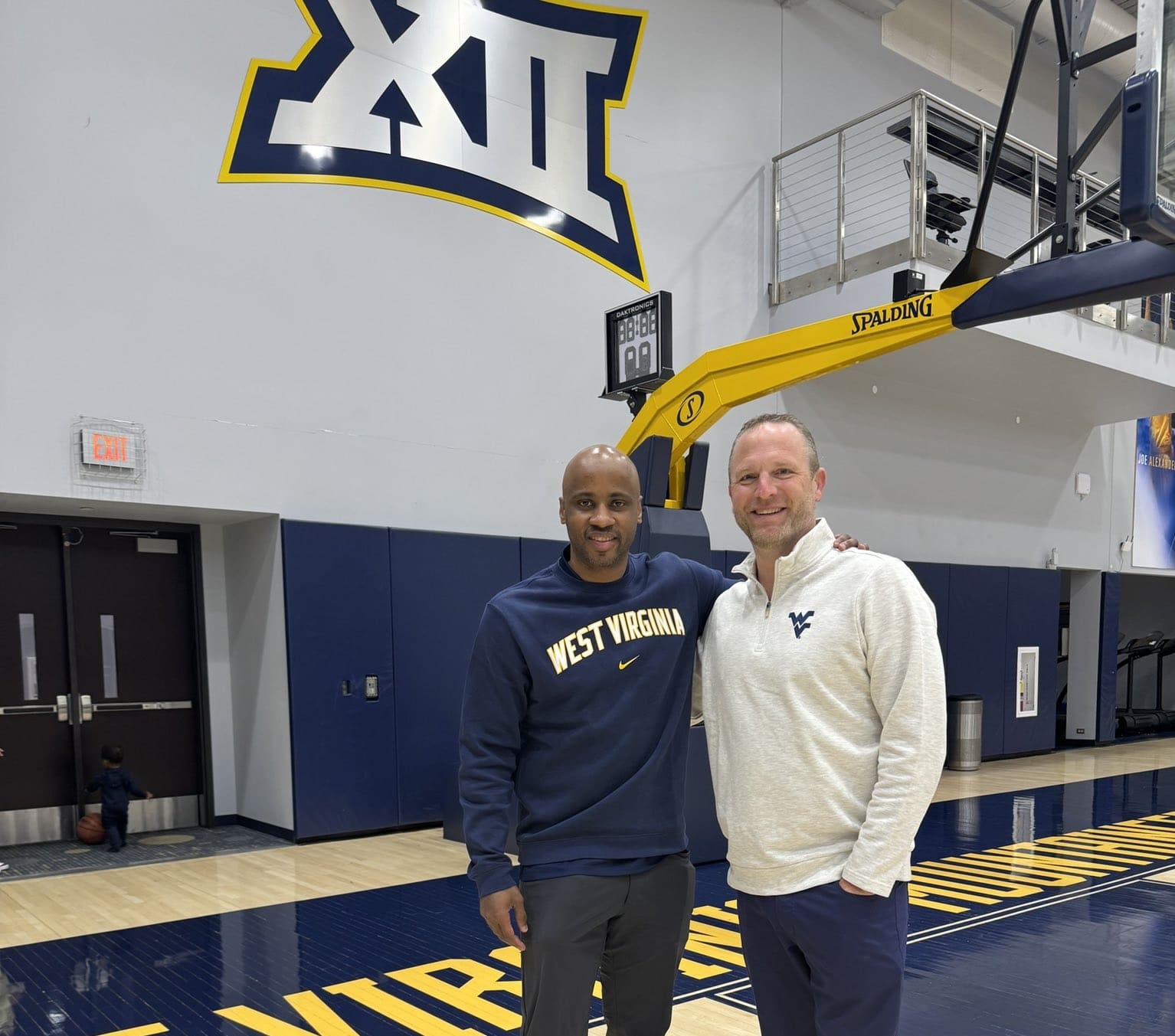 WVU Basketball assistant coach Chester Frazier and HC Darian DeVries