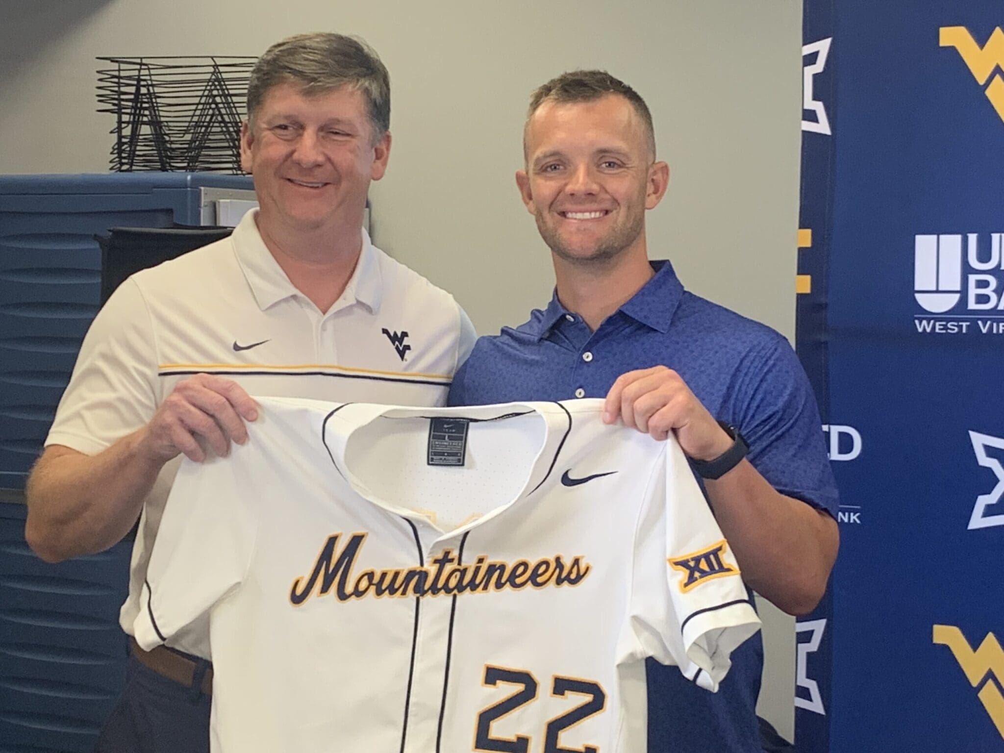 WVU Baseball HC Steve Sabins holding jersey at introductory press conference