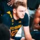 WVu basketball Tucker DeVries in huddle
