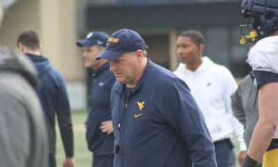 WVU Football HC Rich Rodriguez with Pat White in background