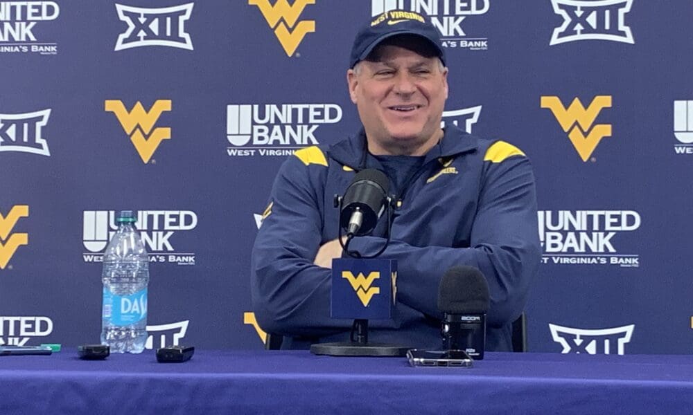 WVU Football HC Rich Rodriguez laughing