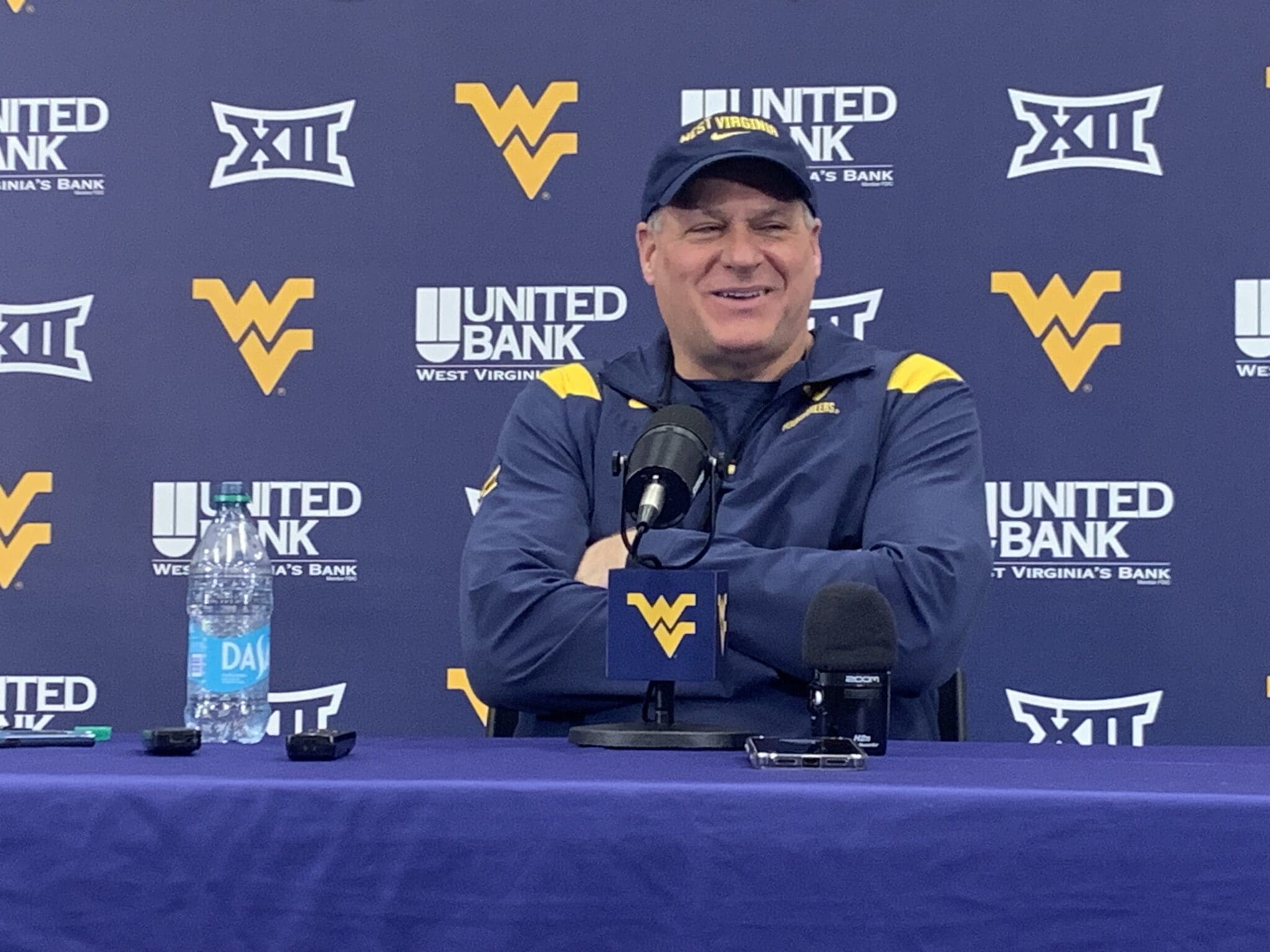 WVU Football HC Rich Rodriguez laughing