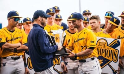 WVU Baseball Steve Sabins and players with Big 12 trophy