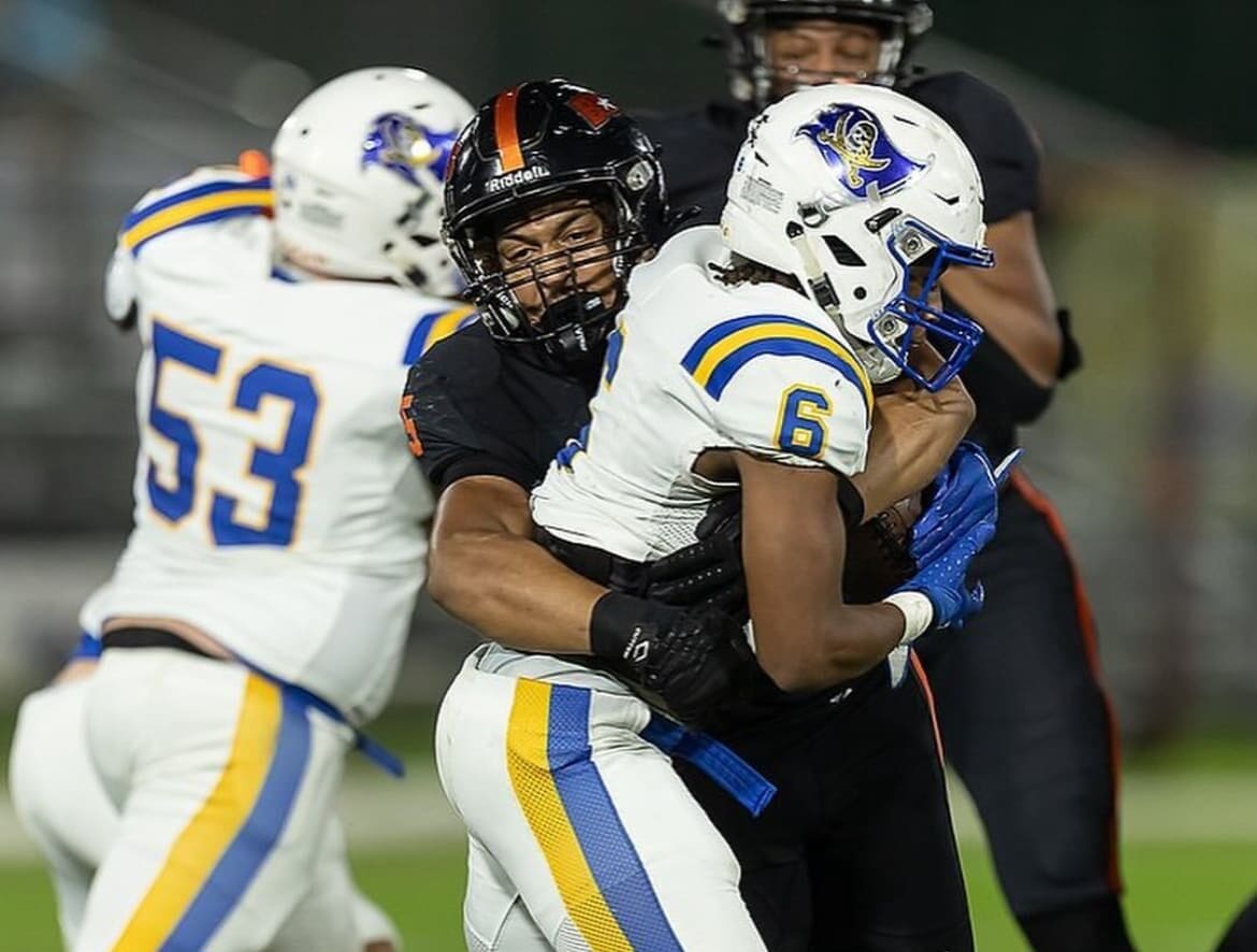 WVU Football incoming freshman linebacker Cam Torbor wraps up for a tackle. Image courtesy of Cam Torbor's Instagram account.