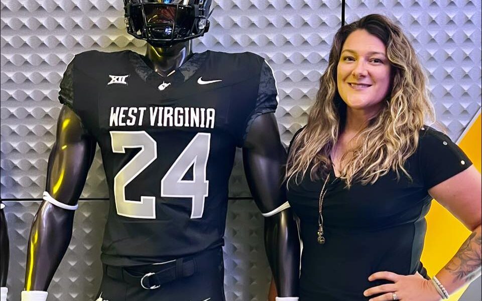 Kristin Coldsnow and WVU Coal Rush uniform