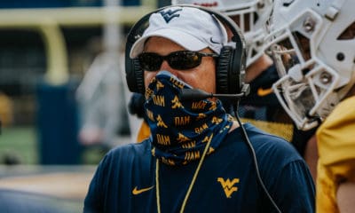 Head coach Neal Brown wearing a mask at practice