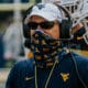 Head coach Neal Brown wearing a mask at practice