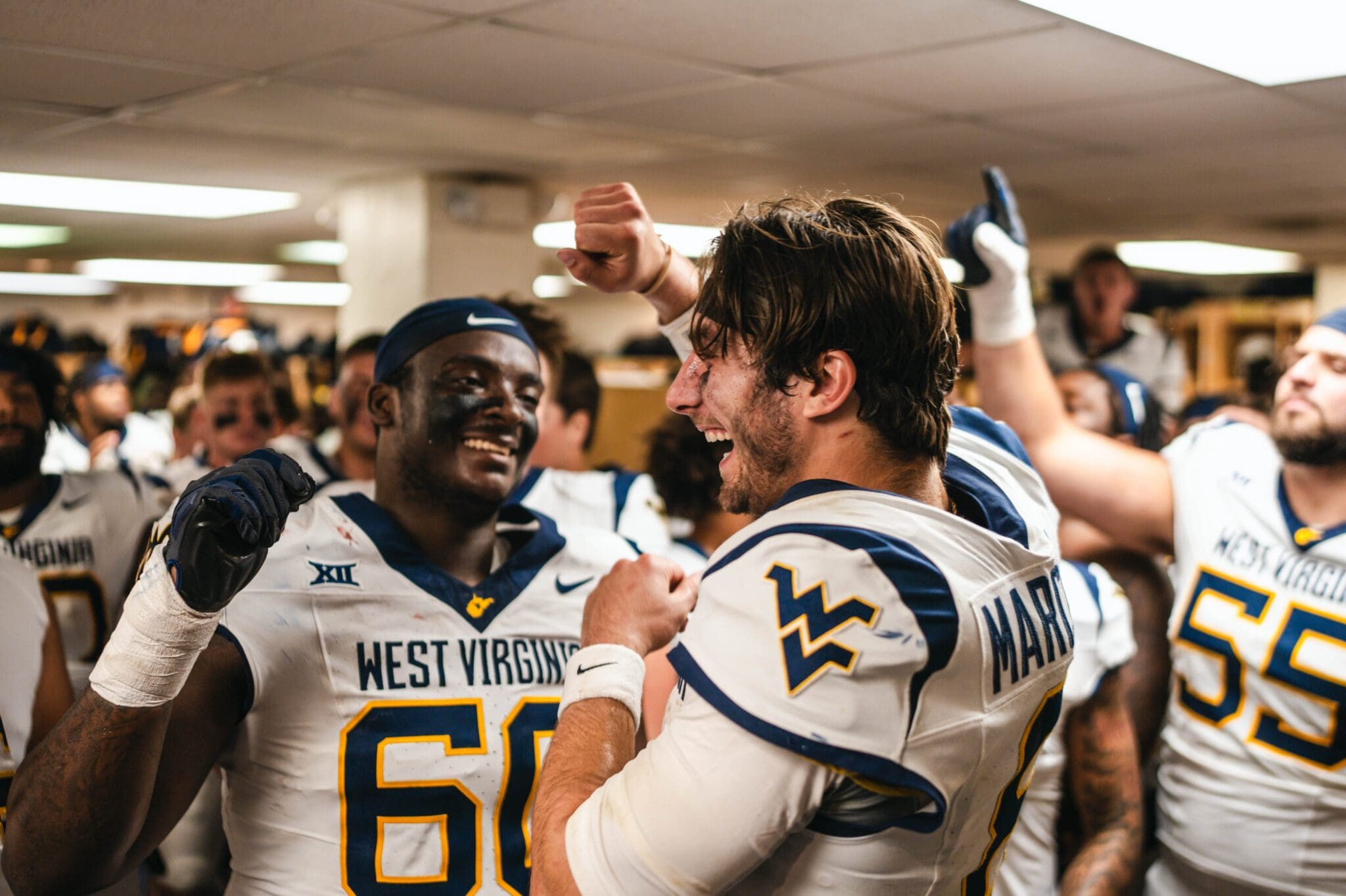 WVU Football QB Nicco Marchiol celebrating