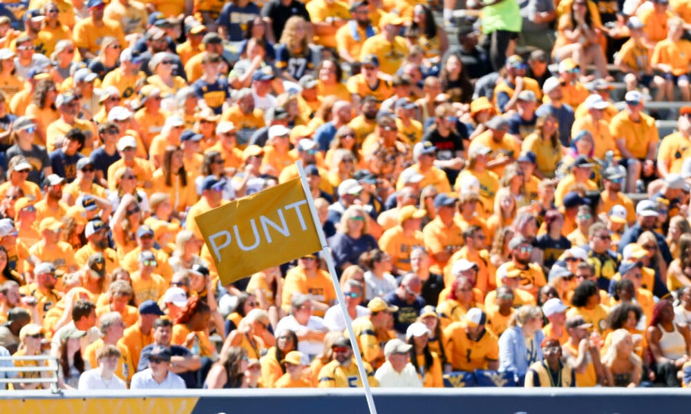 Punt flag at WVU Football game with crowd in background