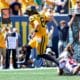 WVU Football QB Nicco Marchiol runs in for a touchdown against RMU