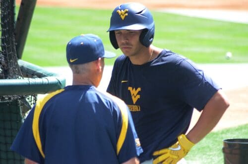 WVU baseball coach Randy Mazey talks to a player at North Carolina's Boshamer Stadium on Thursday, June 6, 2024, ahead of playing UNC in the NCAA Tournament Super Regionals. (Mitchell Northam, WV Sports Now)