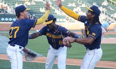 WVU Baseball players goof around as the Mountaineers played against North Carolina on June 8, 2024, in the Super Regionals of the NCAA Tournament at Boshamer Stadium in Chapel Hill, N.C. (Mitchell Northam / WV Sports Now)