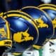 WVU Football helmets rests on the sideline stock