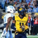 WVU returner Beanie Bishop Jr. after fair catching a punt against UNC in the Duke's Mayo Bowl at Bank of America Stadium in Charlotte, N.C. on Dec. 27, 2023. (Mitchell Northam / WV Sports Now)