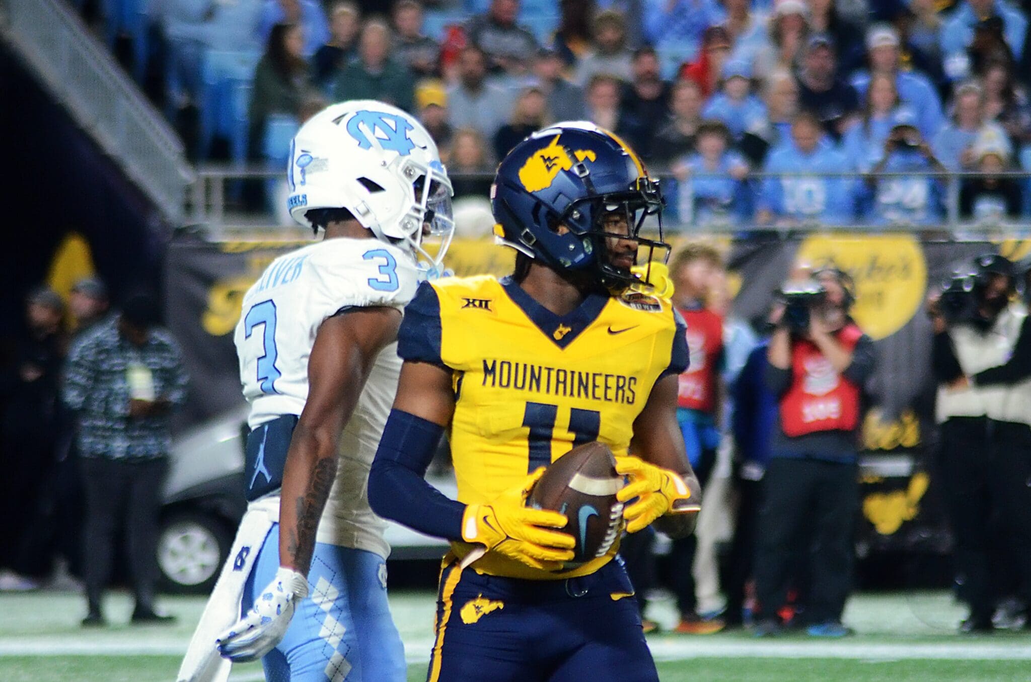 WVU returner Beanie Bishop Jr. after fair catching a punt against UNC in the Duke's Mayo Bowl at Bank of America Stadium in Charlotte, N.C. on Dec. 27, 2023. (Mitchell Northam / WV Sports Now)