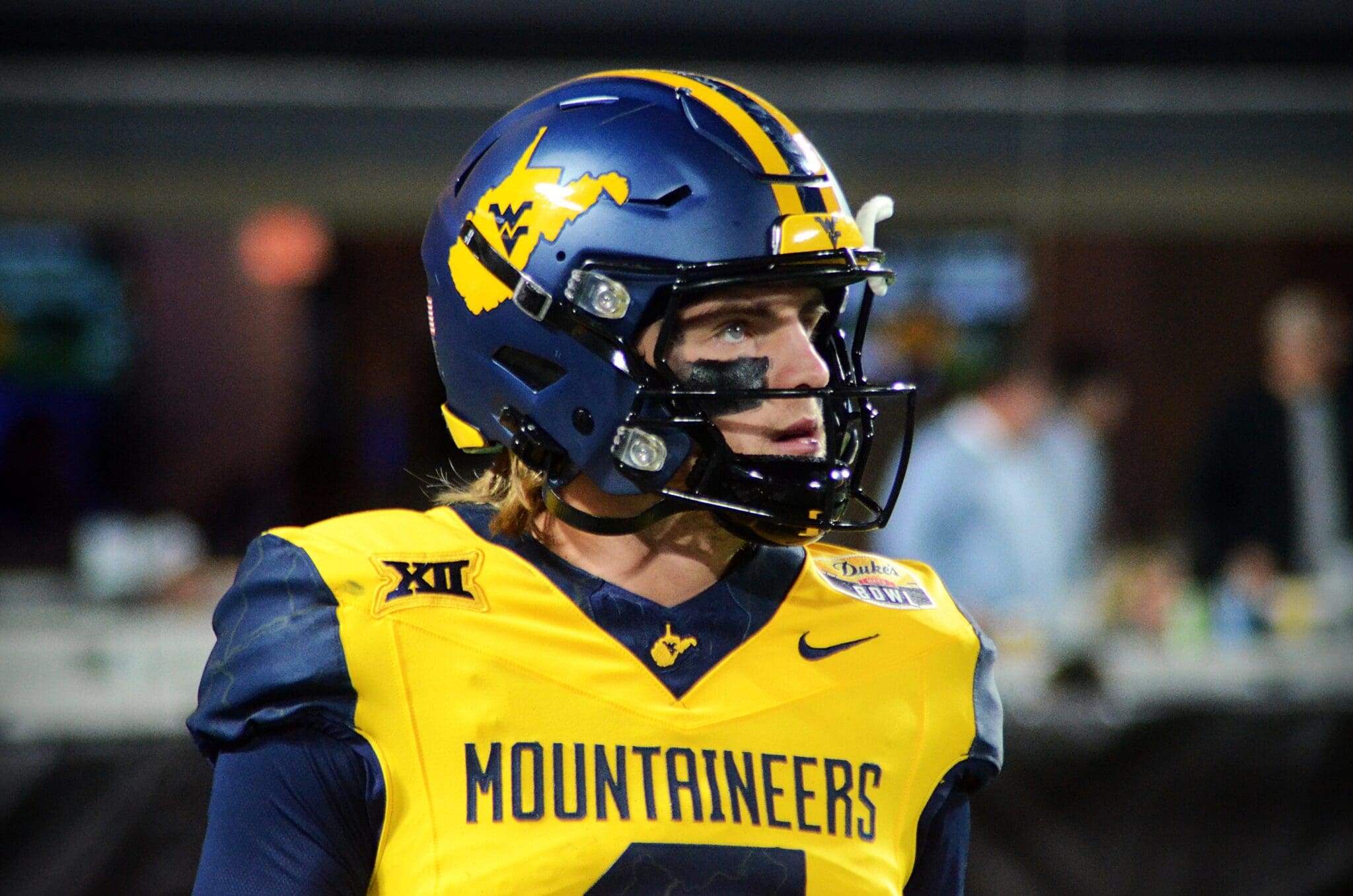 WVU Football quarterback Garrett Greene prepares to take a snap against UNC in the Duke's Mayo Bowl at Bank of America Stadium in Charlotte, N.C. on Dec. 27, 2023. (Mitchell Northam / WV Sports Now)