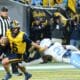 WVU Football quarterback Garrett Greene scrambles against UNC in the Duke's Mayo Bowl at Bank of America Stadium in Charlotte, N.C. on Dec. 27, 2023. (Mitchell Northam / WV Sports Now)