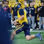 WVU quarterback Garrett Greene scrambles against UNC in the Duke's Mayo Bowl at Bank of America Stadium in Charlotte, N.C. on Dec. 27, 2023. (Mitchell Northam / WV Sports Now)