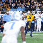 WVU linebacker Tyrin Bradley picks off UNC in the third quarter at the Duke's Mayo Bowl on Dec. 27, 2023 at Bank of America Stadium in Charlotte, N.C. (Mitchell Northam / WV Sports Now)