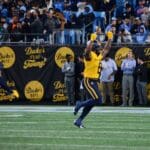 WVU Football linebacker Tyrin Bradley celebrates his third quarter interception against UNC at the Duke's Mayo Bowl on Dec. 27, 2023, at Bank of America Stadium in Charlotte, N.C. (Mitchell Northam / WV Sports Now)