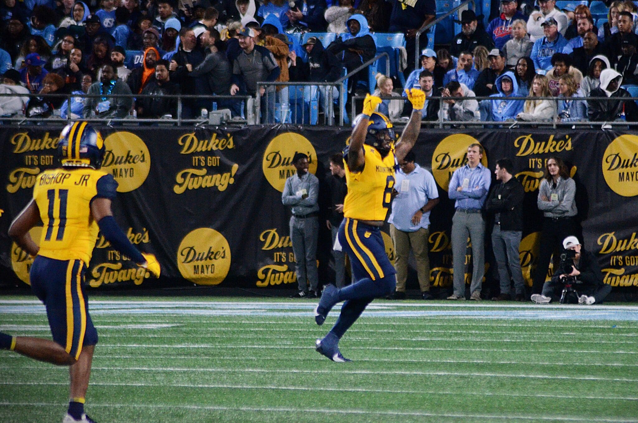 WVU Football linebacker Tyrin Bradley celebrates his third quarter interception against UNC at the Duke's Mayo Bowl on Dec. 27, 2023, at Bank of America Stadium in Charlotte, N.C. (Mitchell Northam / WV Sports Now)