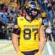 WVU Football tight end Kole Taylor flexes after a big gain against UNC in the Duke's Mayo Bowl at Bank of America Stadium in Charlotte, N.C. on Dec. 27, 2023. (Mitchell Northam / WV Sports Now)