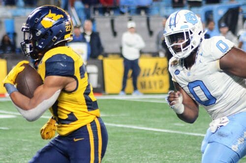 WVU running back Jahiem White rushes against UNC in the Duke's Mayo Bowl at Bank of America Stadium in Charlotte, N.C. on Dec. 27, 2023. (Mitchell Northam / WV Sports Now)