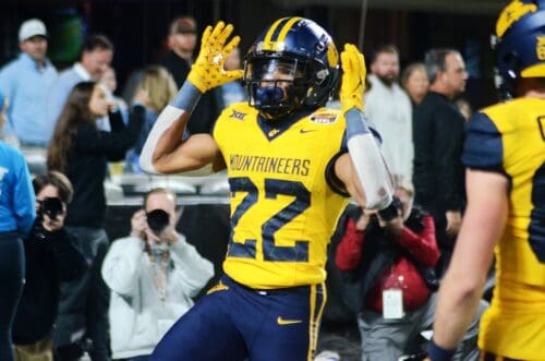 WVU running back Jahiem White celebrates his touchdown against UNC in the Duke's Mayo Bowl at Bank of America Stadium in Charlotte, N.C. on Dec. 27, 2023. (Mitchell Northam / WV Sports Now)