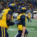 WVU Football Ja'Quay Hubbard and Garrett Greene celebrate a touchdown against UNC in the Duke's Mayo Bowl at Bank of America Stadium in Charlotte, N.C. on Dec. 27, 2023. (Mitchell Northam / WV Sports Now)