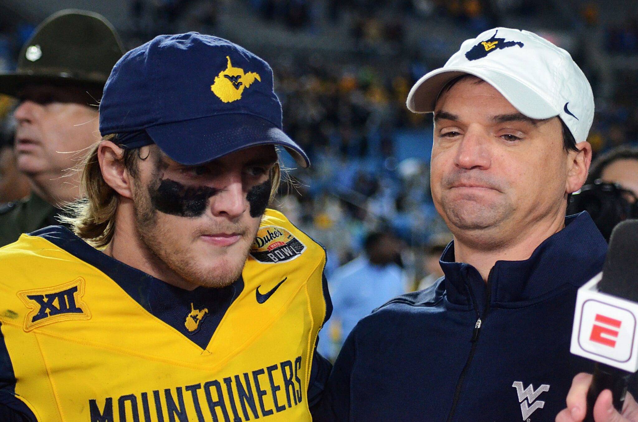 WVU Football quarterback Garrett Greene and head coach Neal Brown after beating UNC in the Duke's Mayo Bowl at Bank of America Stadium in Charlotte, N.C. on Dec. 27, 2023. (Mitchell Northam / WV Sports Now)