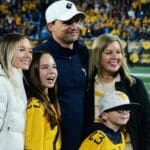 WVU head coach Neal Brown with his family after beating UNC in the Duke's Mayo Bowl at Bank of America Stadium in Charlotte, N.C. on Dec. 27, 2023. (Mitchell Northam / WV Sports Now)