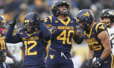 WVU Football Josiah Trotter and Anthony Wilson celebrate against UCF