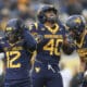 WVU Football Josiah Trotter and Anthony Wilson celebrate against UCF