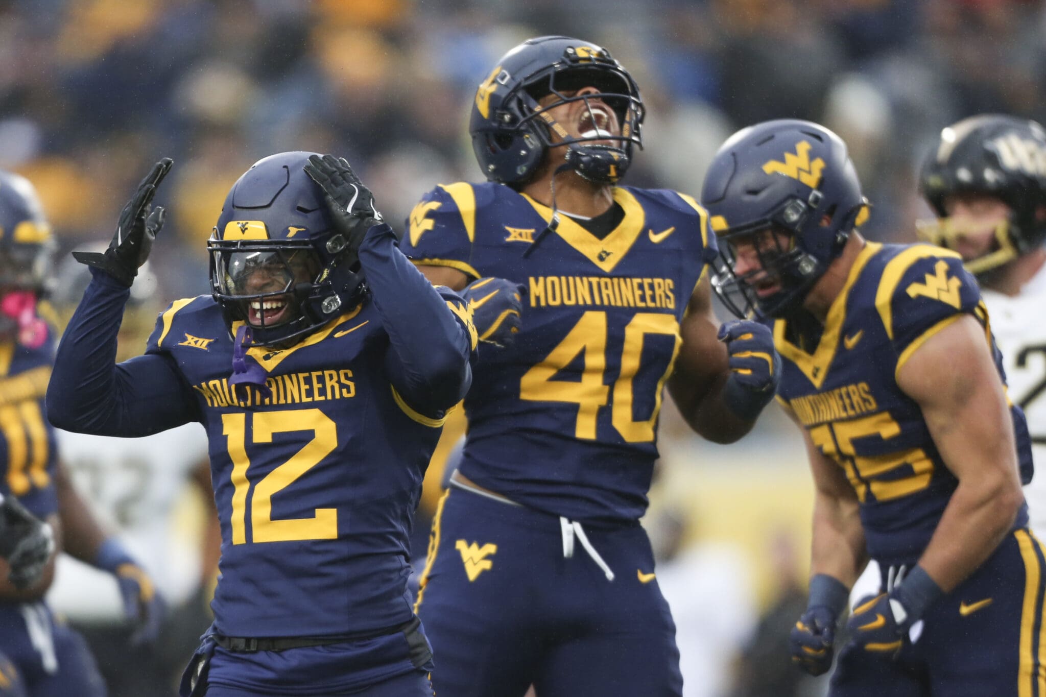 WVU Football Josiah Trotter and Anthony Wilson celebrate against UCF