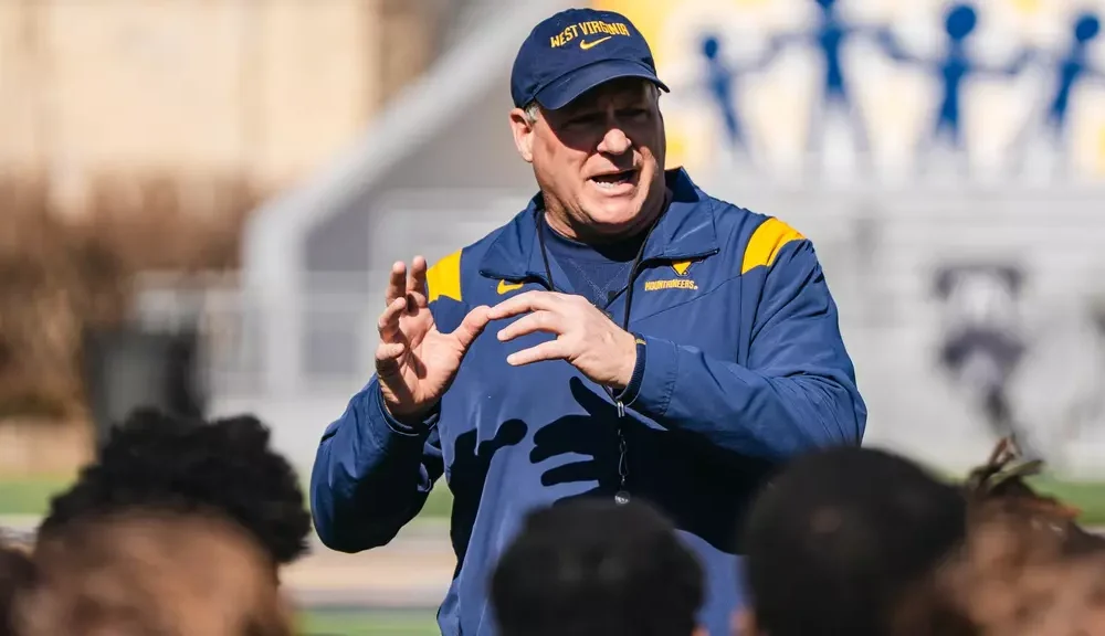 WVU Football HC Rich Rodriguez talking to team after practice