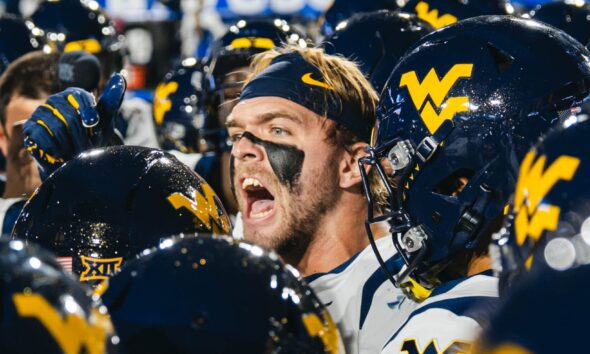WVU Football LB Chase Wilson in Huddle