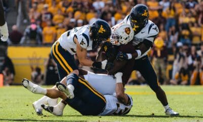 WVU Football defense making tackle at ASU
