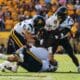WVU Football defense making tackle at ASU