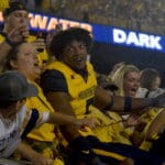 WVU Football Lance Dixon celebrates with fans