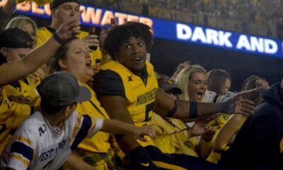 WVU Football Lance Dixon celebrates with fans