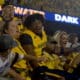 WVU Football Lance Dixon celebrates with fans